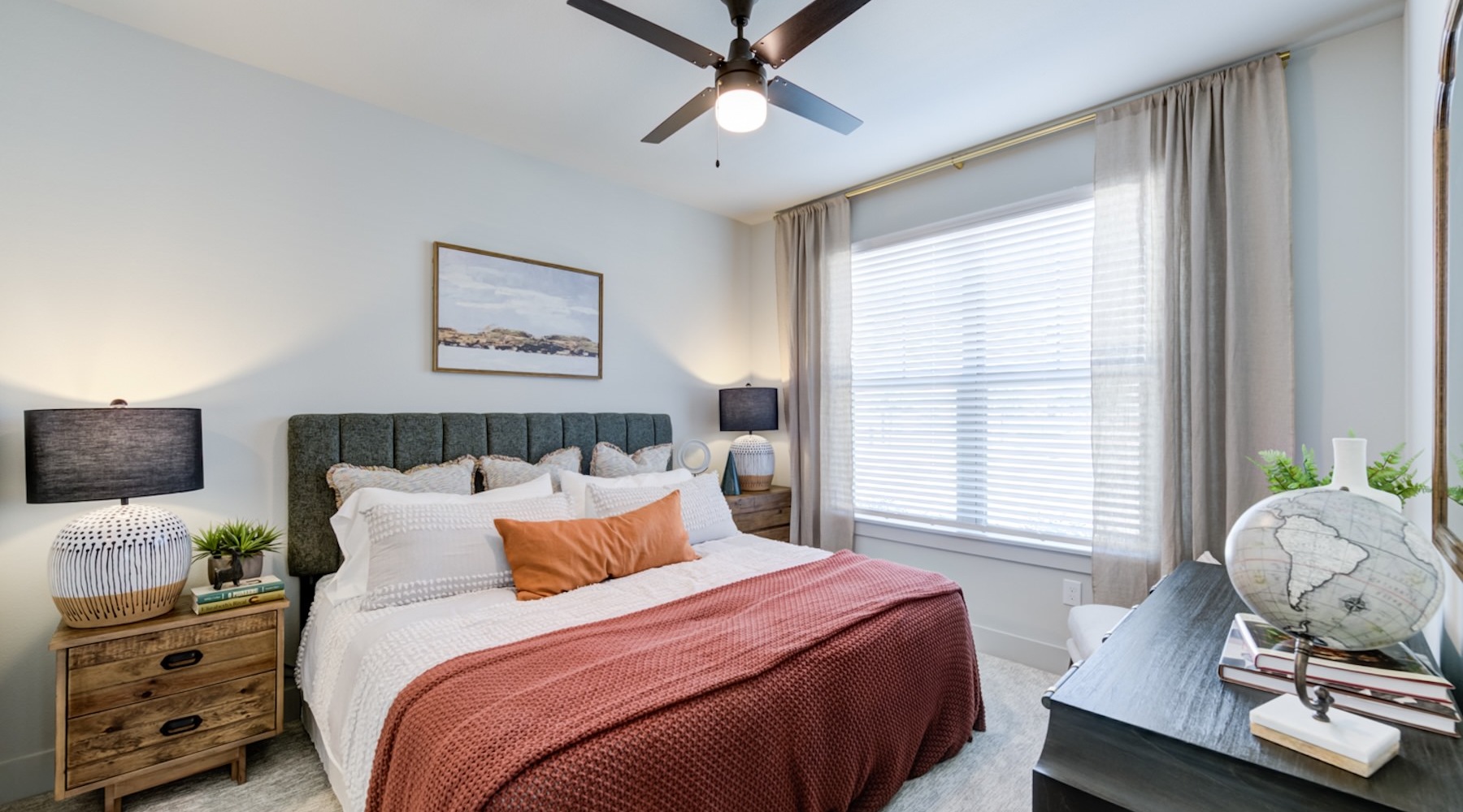 a bedroom with a bed and two nightstands