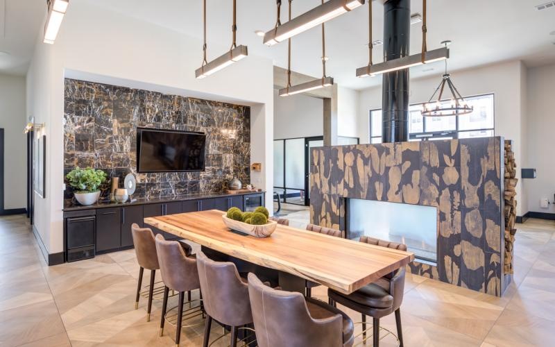a community kitchen with a table and chairs