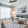 a bedroom with a fan and a bed