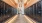 a hallway with black mail boxes